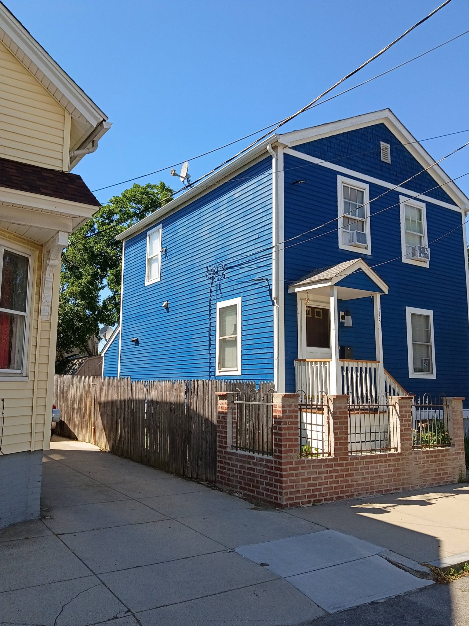 Blue house exterior painting with white trim in Rhode Island