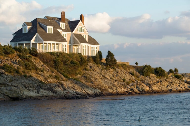 Coastal home facade painting with white trim