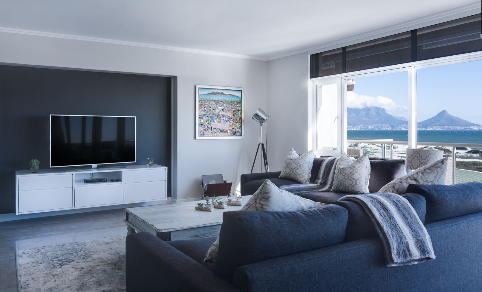 Living room with a dark TV wall and low media cabinet
