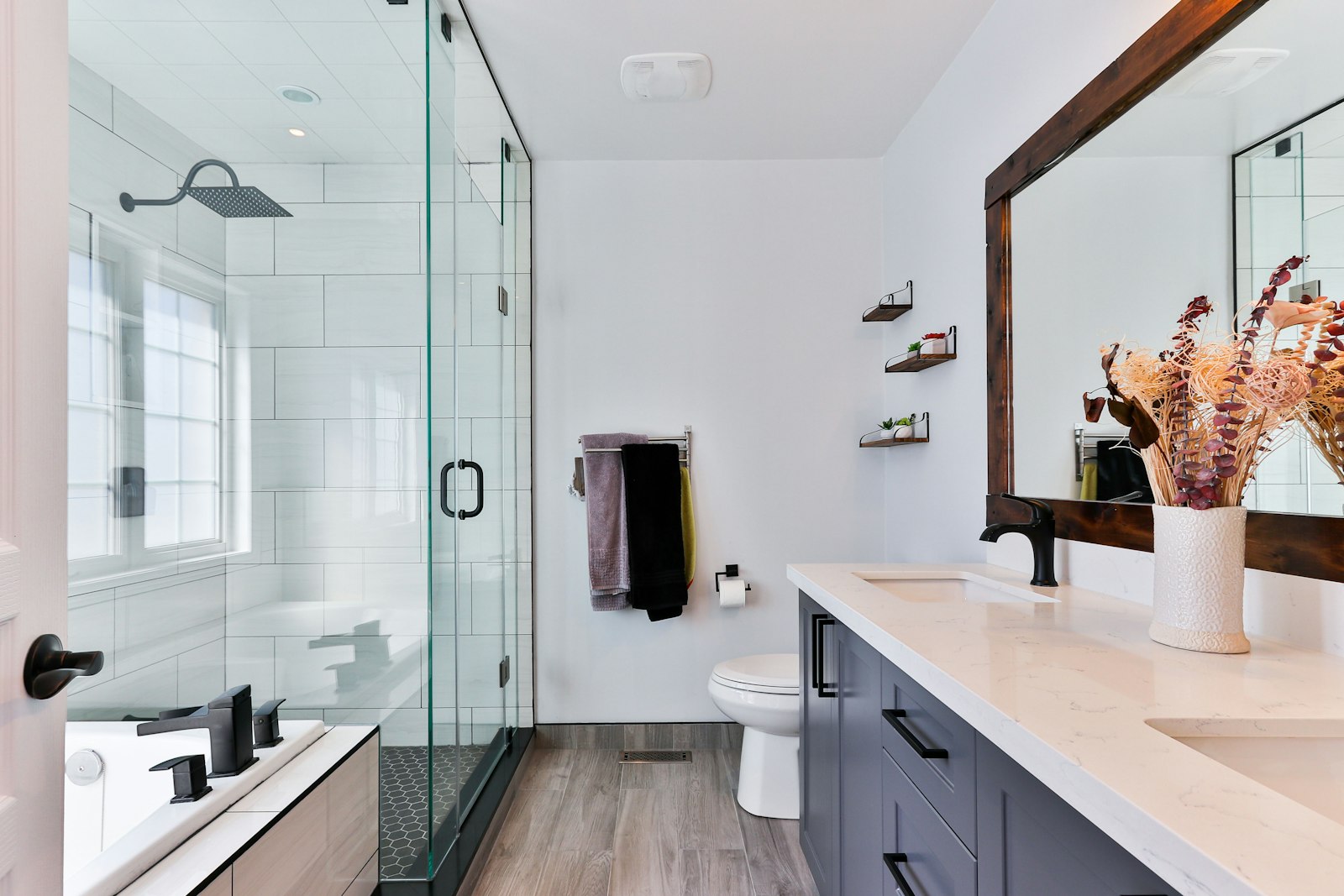 Luxury vanity millwork with stone top and framed mirror